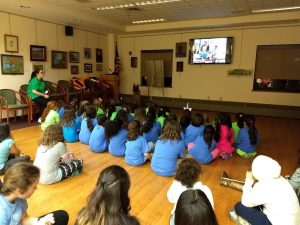 Exepnathos leads a PSAR presentation for a group of Girl Scouts